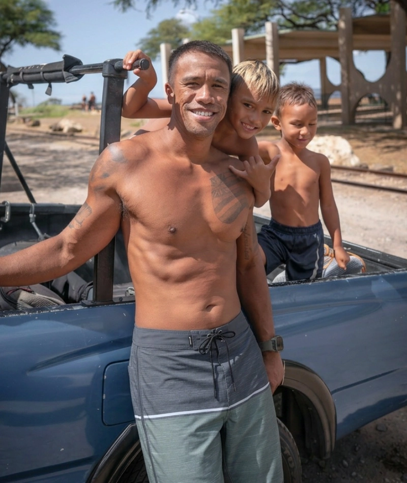 Local man with kids parked at the beach.