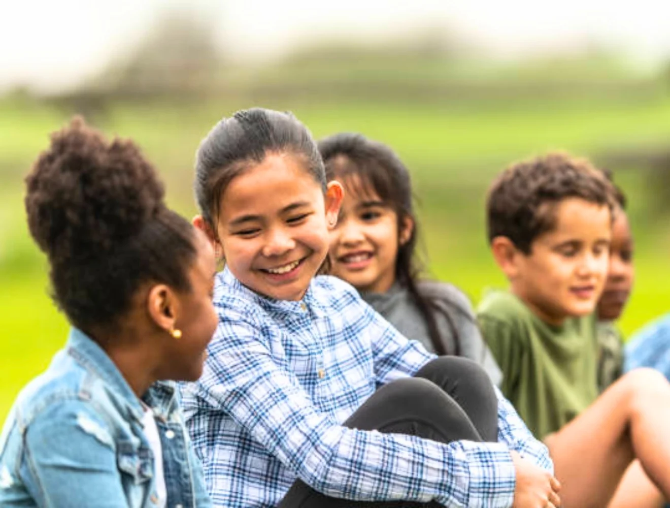 children sitting and talking