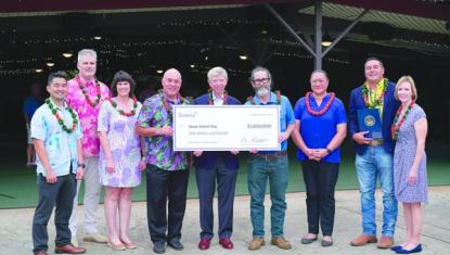 People posing with large Sentry award check
