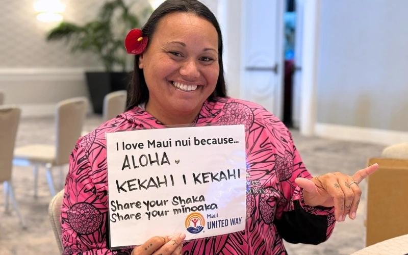 MUW Popup woman making shaka sign holding up sign
